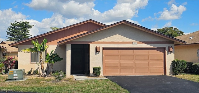 view of front of property featuring a garage and a front yard