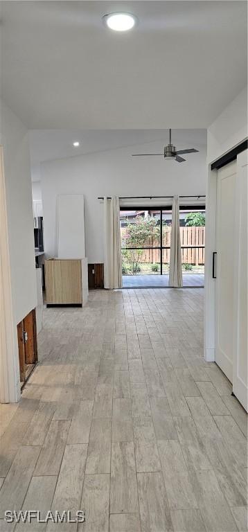 corridor featuring a barn door