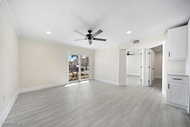 unfurnished room featuring crown molding, light hardwood / wood-style floors, and ceiling fan