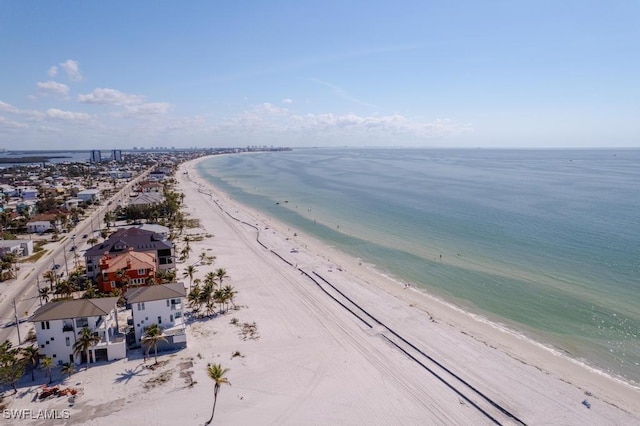 aerial view with a water view and a view of the beach