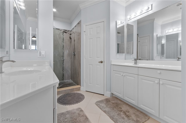 bathroom featuring two vanities, ornamental molding, a stall shower, a sink, and tile patterned floors