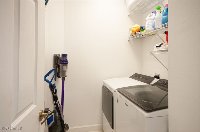 washroom with laundry area and washing machine and clothes dryer