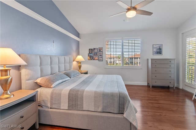 bedroom featuring a ceiling fan, dark wood-style flooring, vaulted ceiling, and baseboards