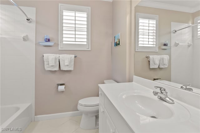 bathroom with baseboards, toilet, tile patterned flooring, crown molding, and vanity