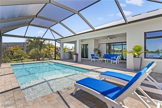 outdoor pool featuring glass enclosure, an outdoor living space, a patio area, and ceiling fan
