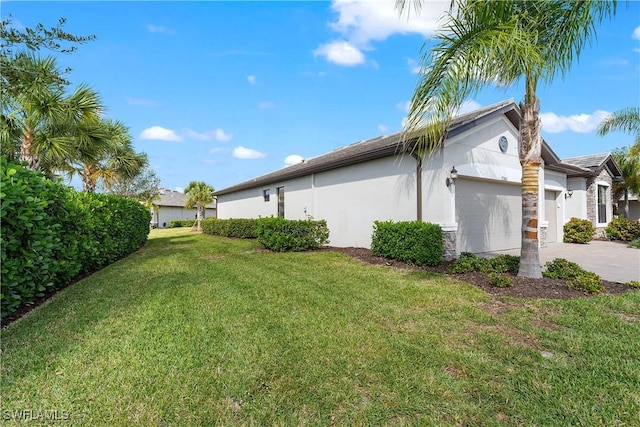 view of home's exterior featuring a garage and a lawn