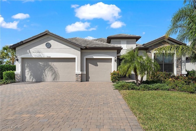 view of front of house with a front lawn and a garage