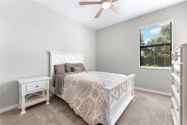 bedroom with ceiling fan and light colored carpet