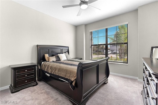 bedroom featuring light carpet and ceiling fan