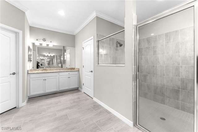 bathroom featuring ornamental molding, vanity, and walk in shower