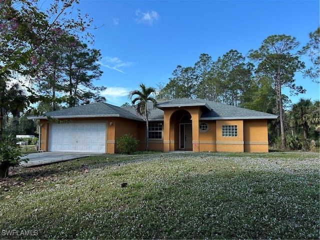 view of front of house with a garage and a front yard