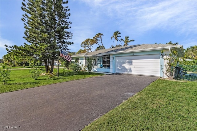 ranch-style house with a garage and a front yard