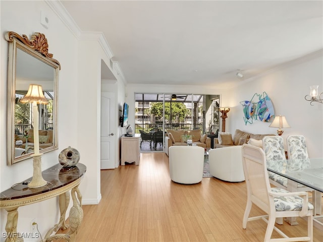 living room featuring ornamental molding and light wood-type flooring