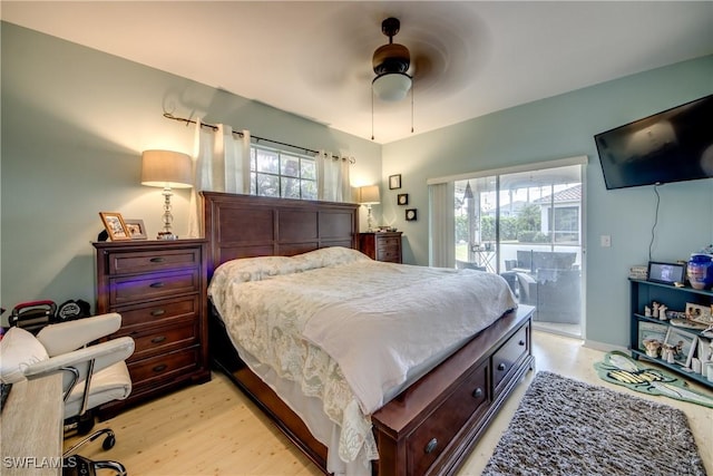 bedroom featuring multiple windows, access to exterior, light hardwood / wood-style floors, and ceiling fan