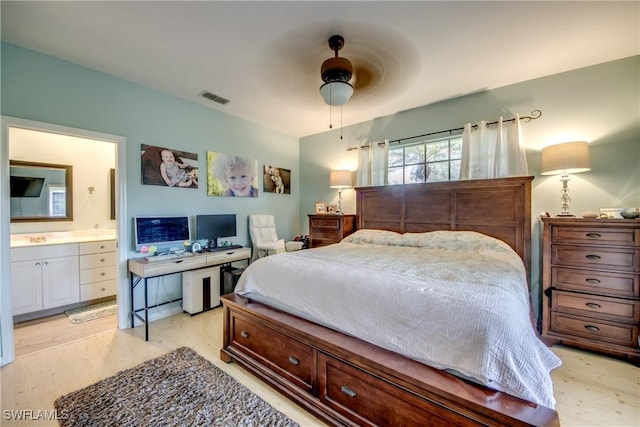 bedroom featuring ceiling fan, sink, connected bathroom, and light hardwood / wood-style floors