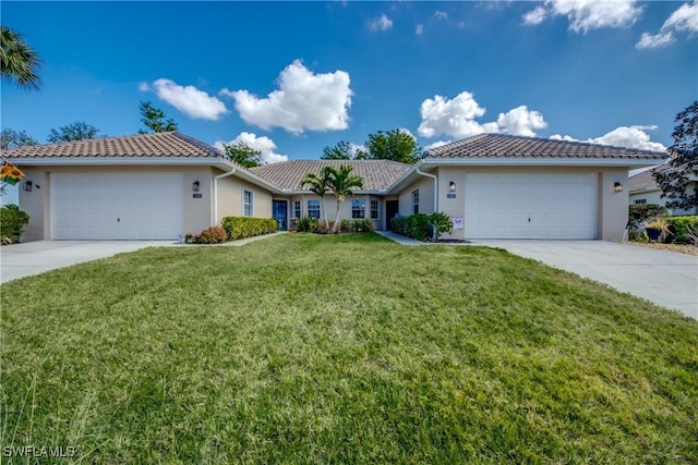 view of front facade featuring a garage and a front yard