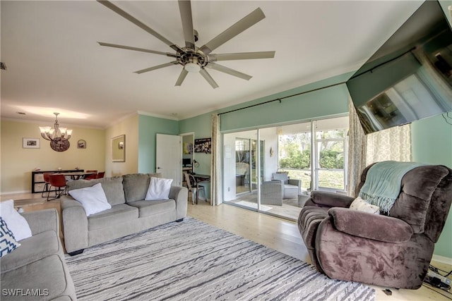 living room with crown molding, ceiling fan with notable chandelier, and light wood-type flooring