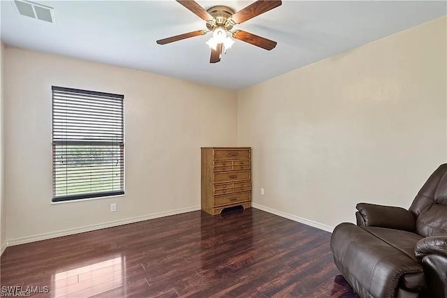 sitting room featuring dark hardwood / wood-style floors and ceiling fan