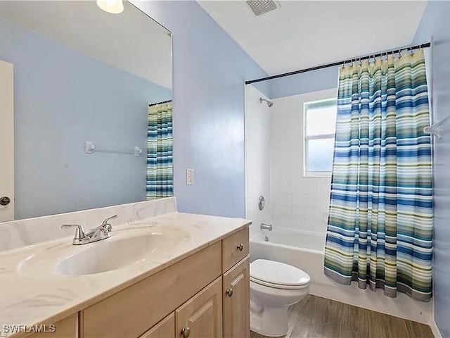 full bathroom featuring shower / bath combination with curtain, vanity, toilet, and hardwood / wood-style flooring