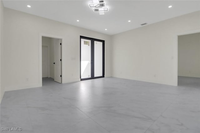 spare room featuring french doors