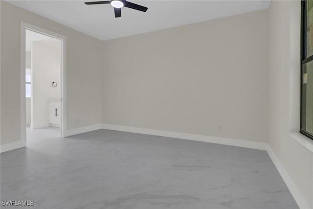 unfurnished room with ceiling fan