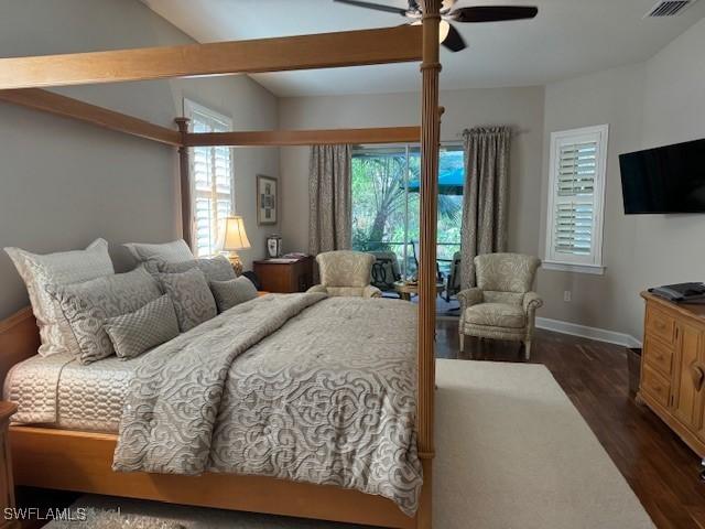 bedroom featuring dark hardwood / wood-style floors and ceiling fan