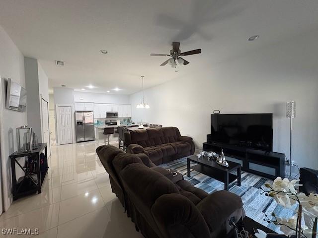 living room featuring light tile patterned floors, recessed lighting, visible vents, and a ceiling fan