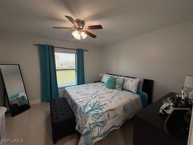 bedroom featuring ceiling fan and baseboards