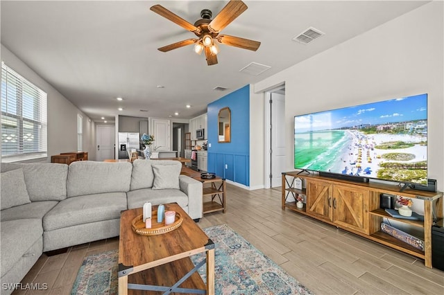 living room with ceiling fan