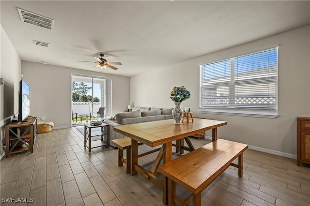 dining room with hardwood / wood-style floors and ceiling fan