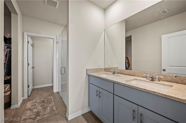 bathroom with vanity and walk in shower