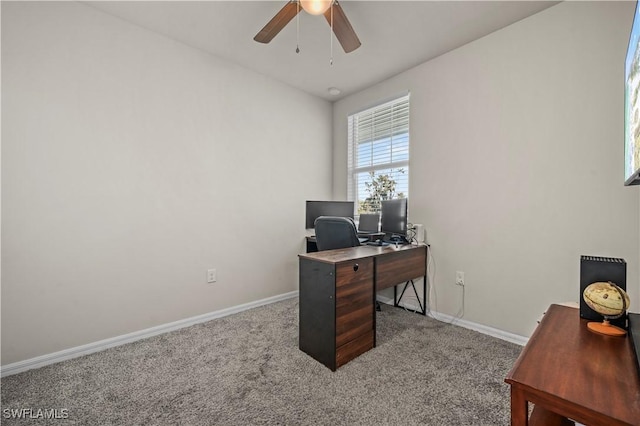 carpeted home office with ceiling fan