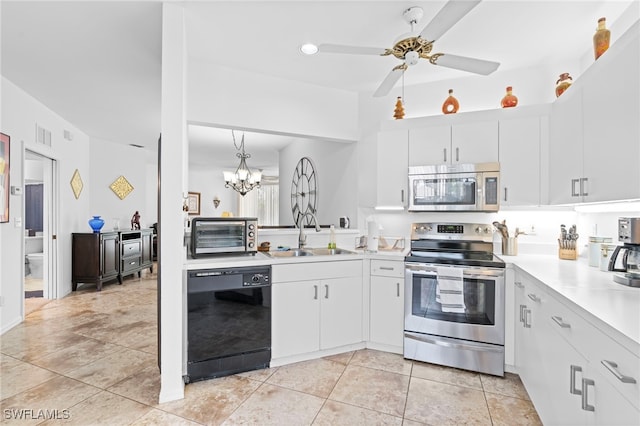 kitchen with a sink, white cabinetry, stainless steel appliances, and light countertops