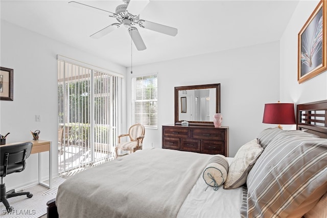 carpeted bedroom with ceiling fan, access to outside, and baseboards