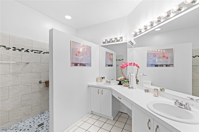 full bathroom with tile patterned flooring, a walk in shower, a sink, and double vanity