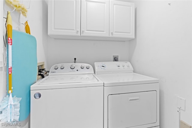 laundry area featuring cabinet space and separate washer and dryer