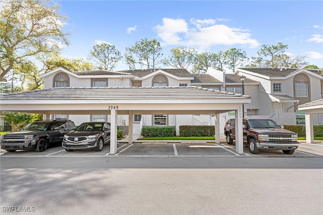 view of partially covered parking lot