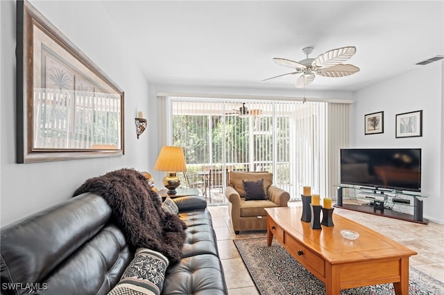 living room featuring visible vents, ceiling fan, and light tile patterned flooring