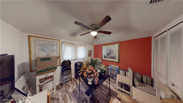 dining space featuring ceiling fan and wood-type flooring