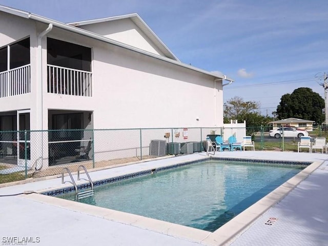 view of pool featuring cooling unit