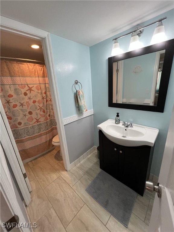 bathroom with vanity and toilet