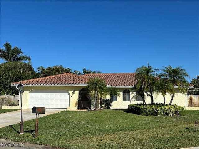 view of front of home featuring a garage and a front lawn