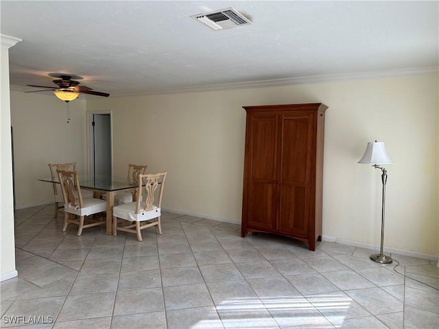 dining space featuring crown molding, light tile patterned floors, and ceiling fan