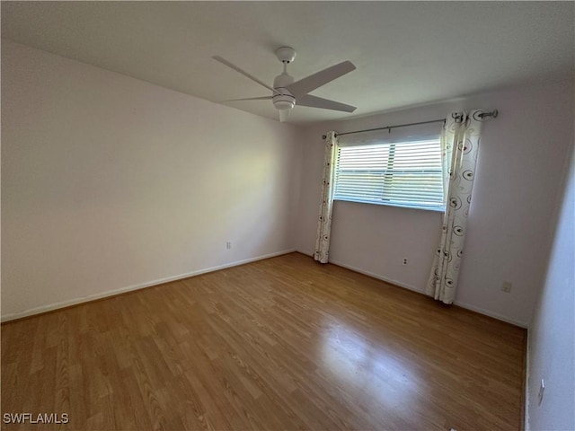 empty room with light hardwood / wood-style flooring and ceiling fan