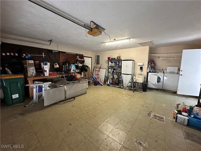 garage featuring a garage door opener and washing machine and clothes dryer