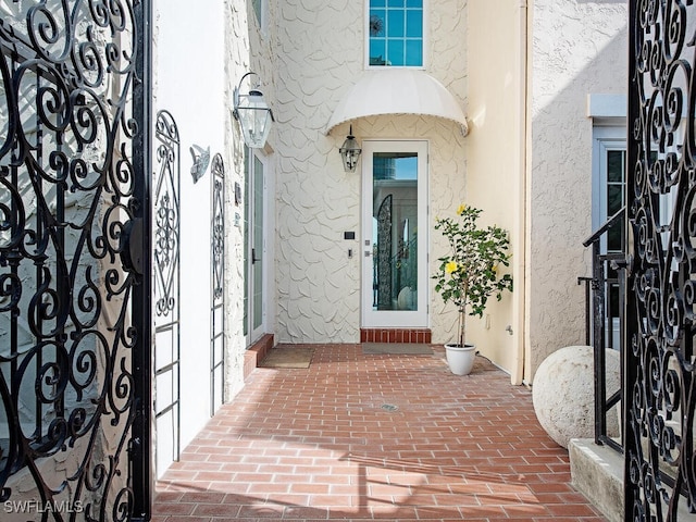 entrance to property featuring a patio area