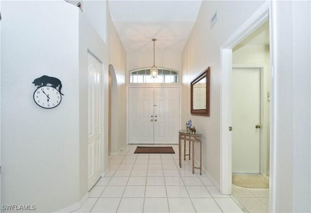 foyer entrance with light tile patterned flooring