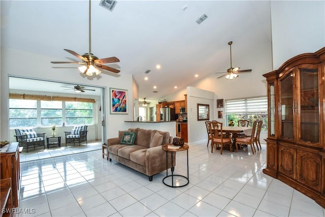 tiled living room with high vaulted ceiling