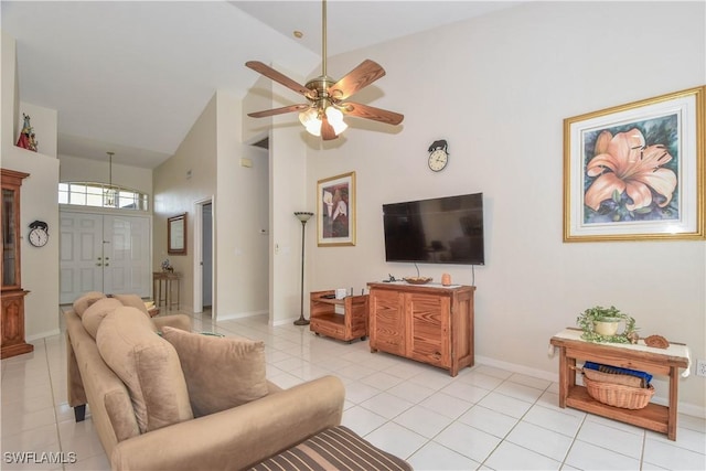 living room featuring ceiling fan, light tile patterned floors, and high vaulted ceiling