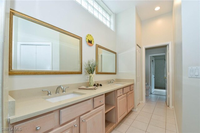 bathroom with vanity and tile patterned floors